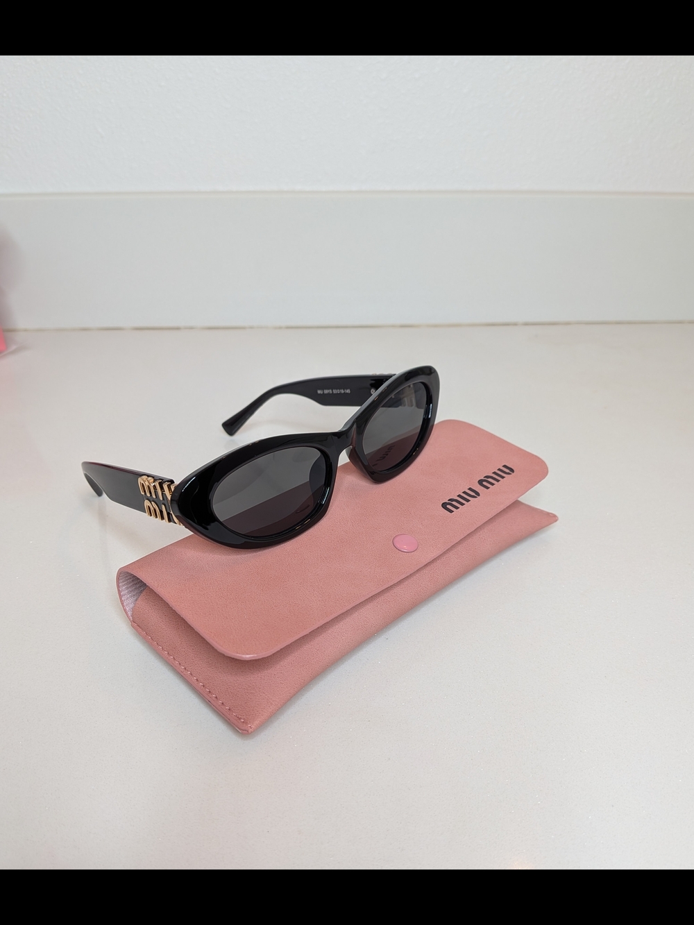 Miu Miu Women's Black Oval Cat Eye Sunglasses - Picture 5 of 13